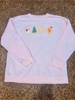 Cozy Pink Holiday Crewneck Sweater with Festive Icons